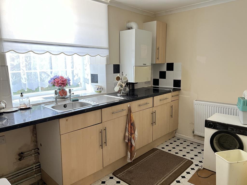 Lot: 10 - THREE-BEDROOM FLAT FOR INVESTMENT OR OCCUPATION - Kitchen with fitted units and wall mounted boiler